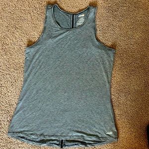 Avia women’s athletic top size XS. Tiny stripe print with cute back detail